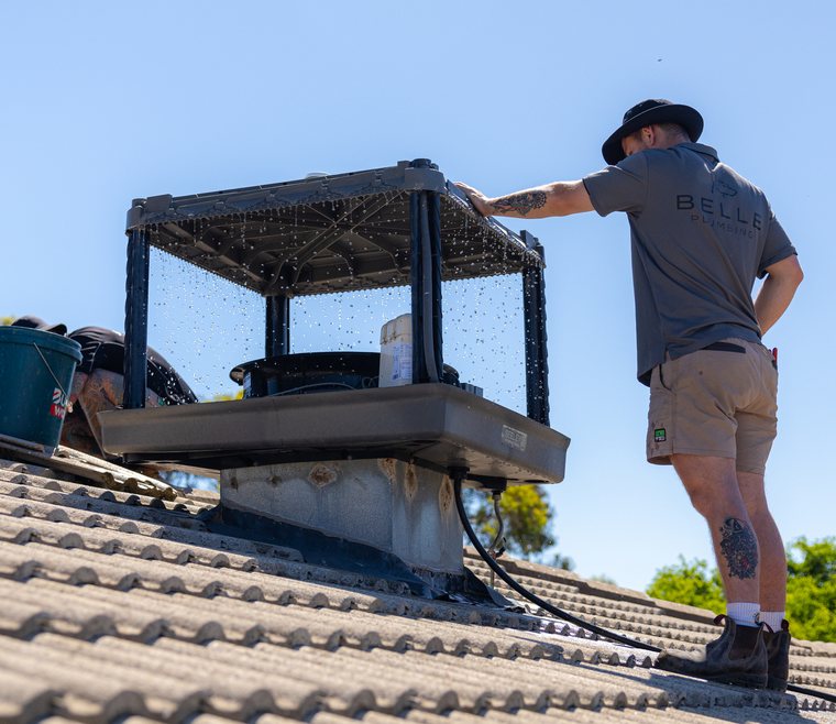 Two technicians on a roof install