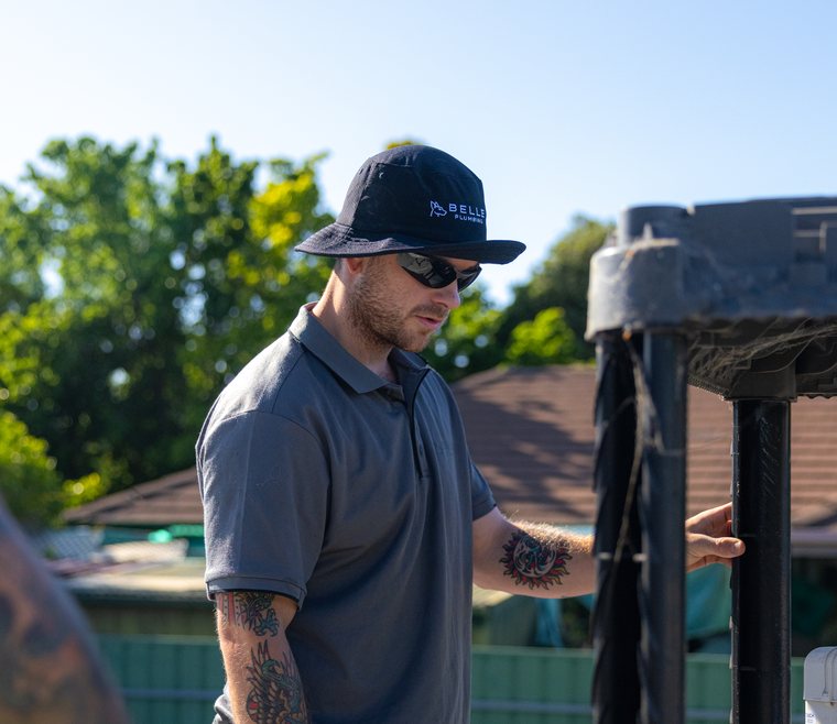Hands-on repair work on an evaporative cooling unit