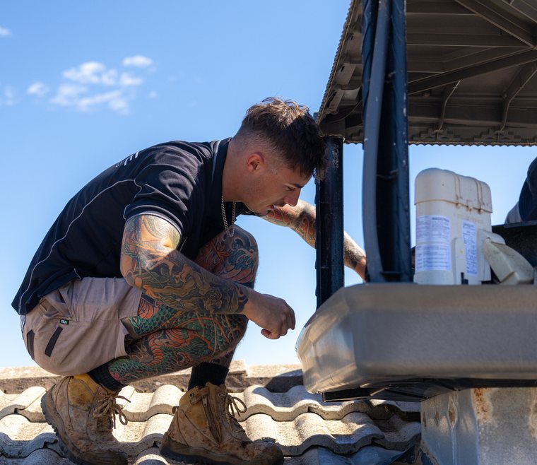 Repair work on a rooftop unit