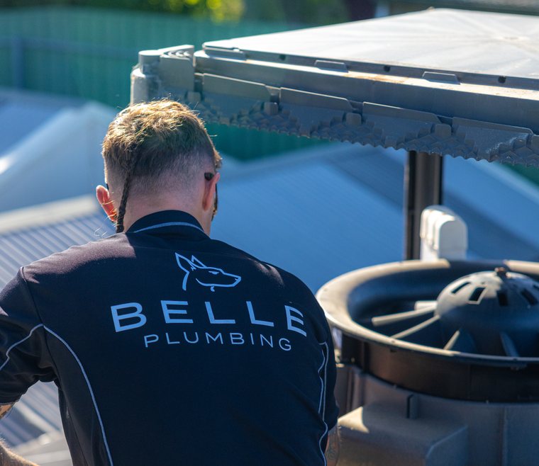 Removing an old evaporative cooler from a roof