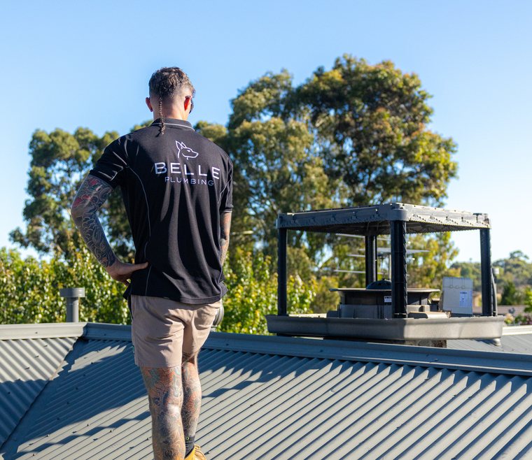 New evaporative cooler in place on a roof
